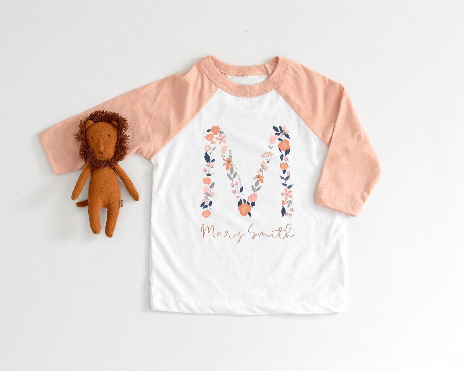 Matching family graphic tees in coordinated designs for family photos, holiday events, and milestone celebration wear
