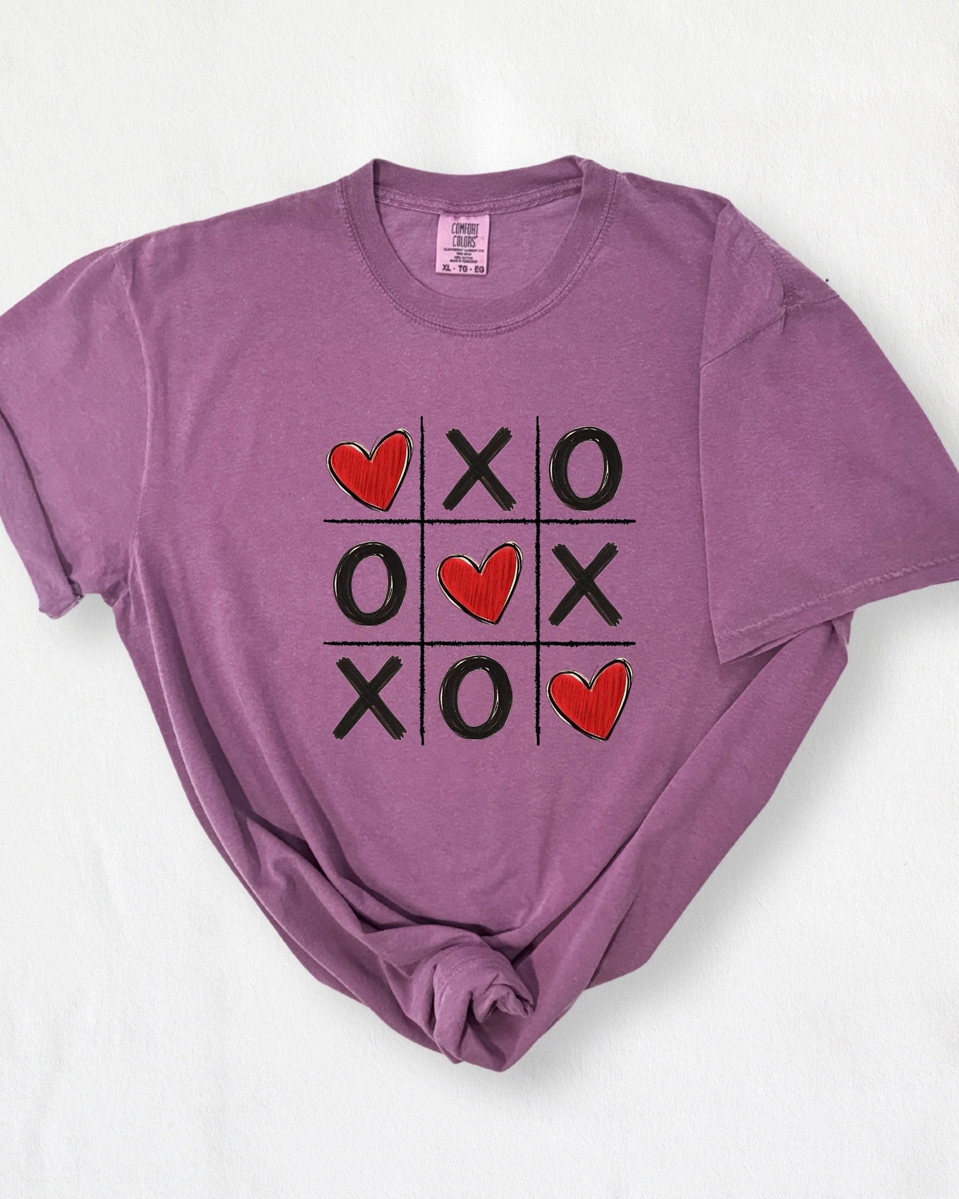 berry t-shirt with heart and cross-out design on a white background