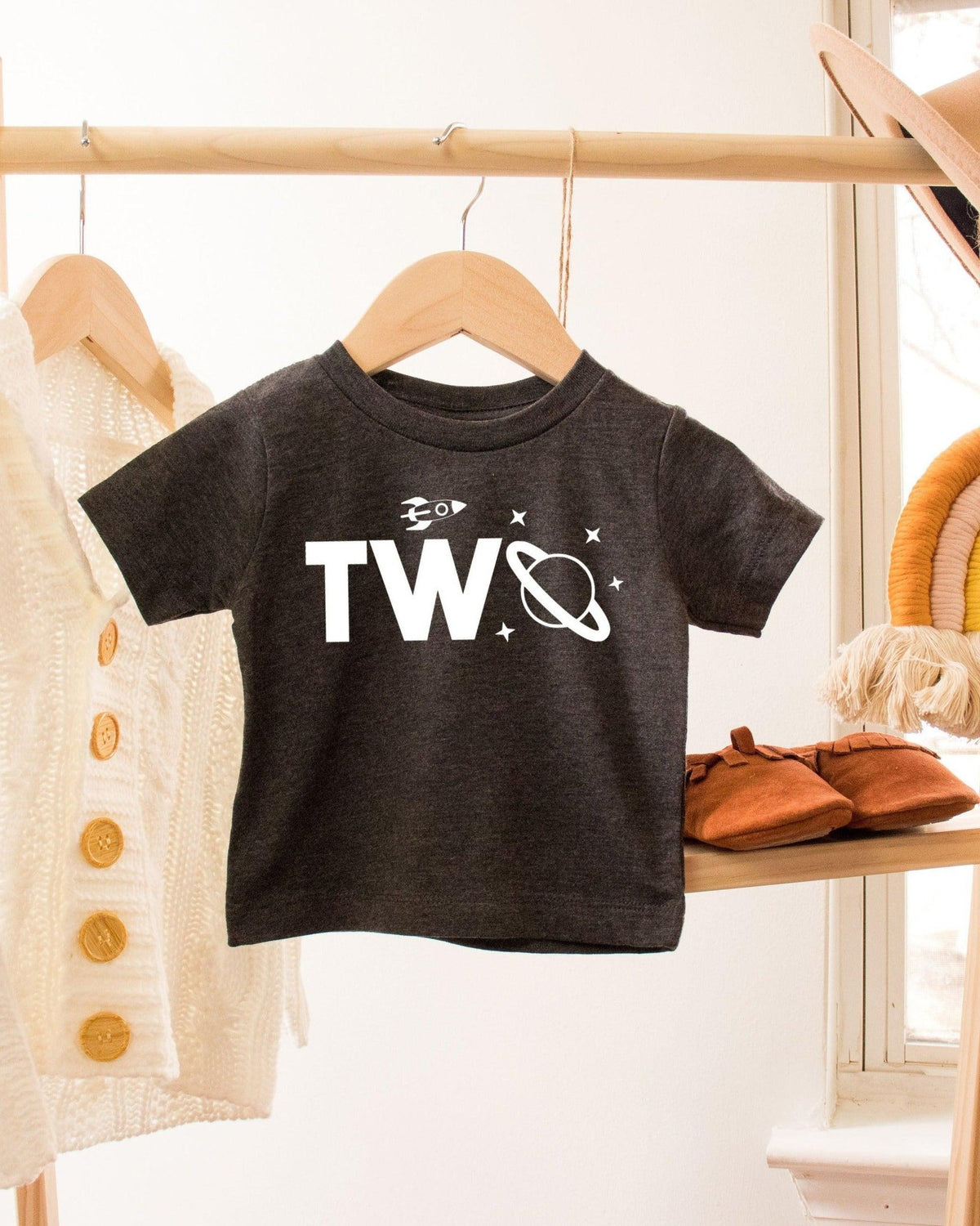 Charcoal gray toddler t-shirt with "TWO" in white, featuring a rocket and planet design.
