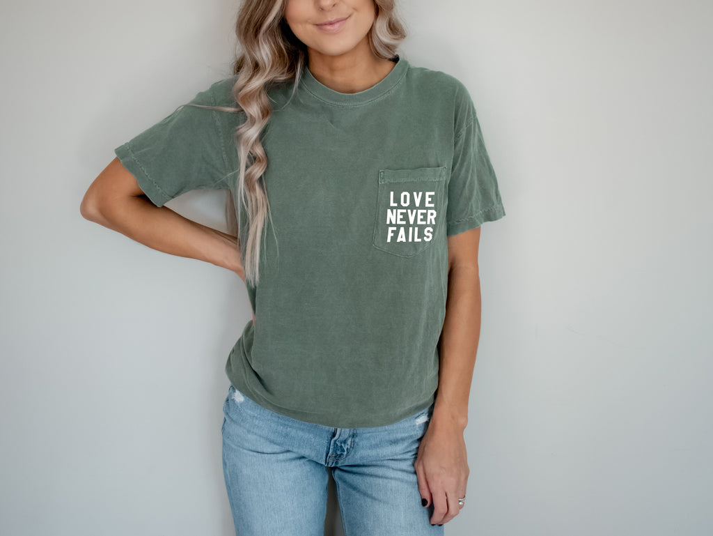 Love Never Fails Christian Comfort Colors Pocket T Shirt